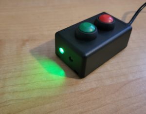 Small black box with 2 buttons and 2 LEDs